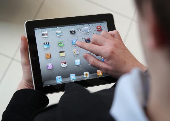 109227675-in-this-photo-illustration-a-man-uses-an-apple-ipad 109227675-in-this-photo-illustration-a-man-uses-an-apple-ipad