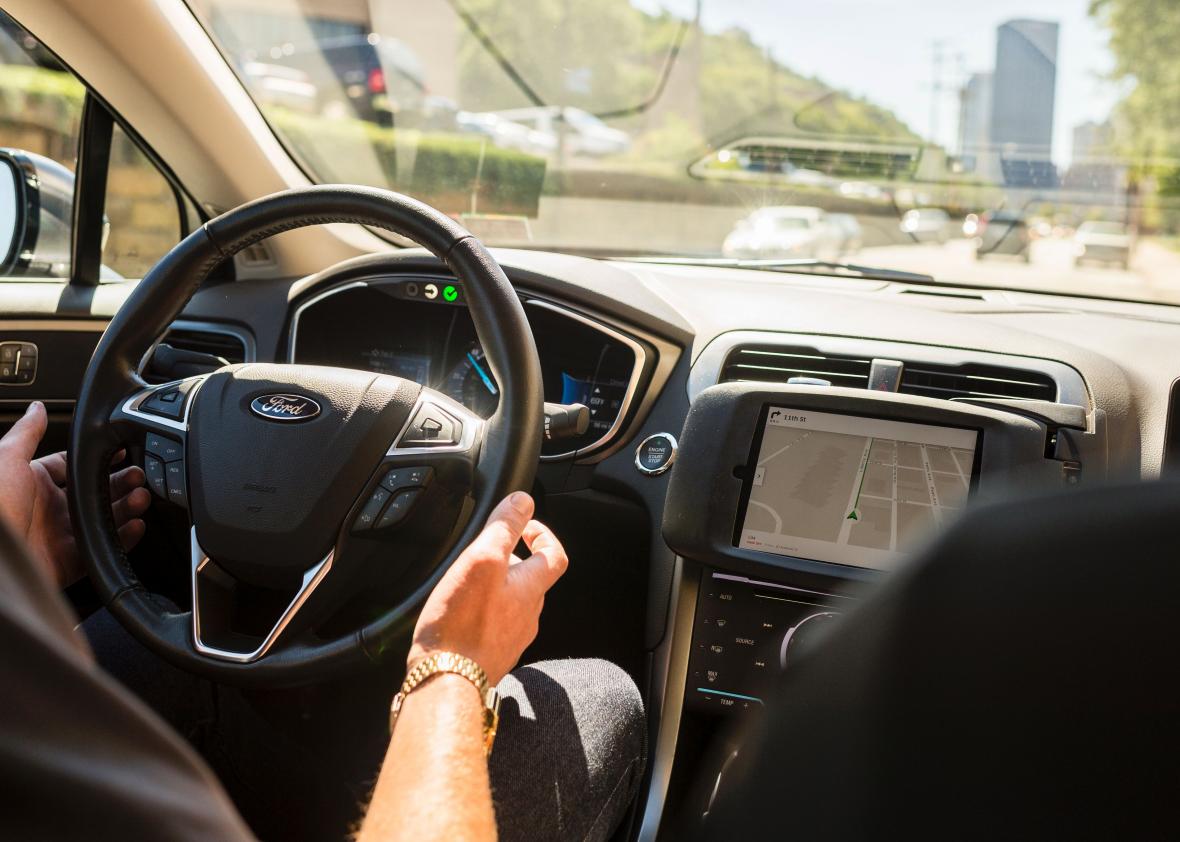 605520024-driver-looks-from-an-uber-self-driving-car-on-september