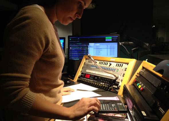 All Things Considered director Monika Evstatieva during a live broadcast in NPR&rsquo;s Studio 2A, where clocks abound. 