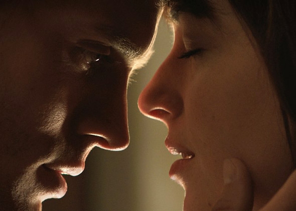 Dakota Johnson and Jamie Dornan in Fifty Shades of Grey (2015).