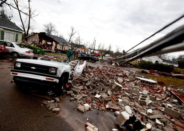 161466822-car-sits-destroyed-by-fallen-debris-after-a-tornado