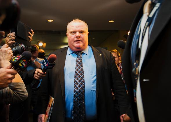 188110889-toronto-mayor-rob-ford-is-swarmed-by-media-at-city-hall