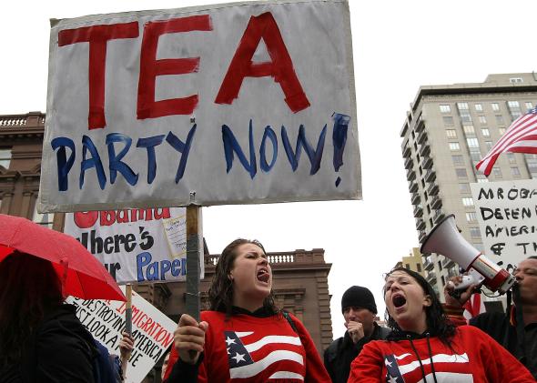 100720971-members-of-the-tea-party-movement-protest-outside-the